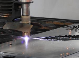Cutting metal sheet with a laser cutting tool.